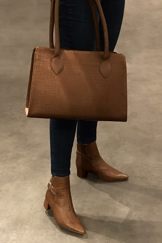 Caramel brown women's ankle boots with buckles at the back. Tapered toe. Low flare heels. Worn view - Florence KOOIJMAN